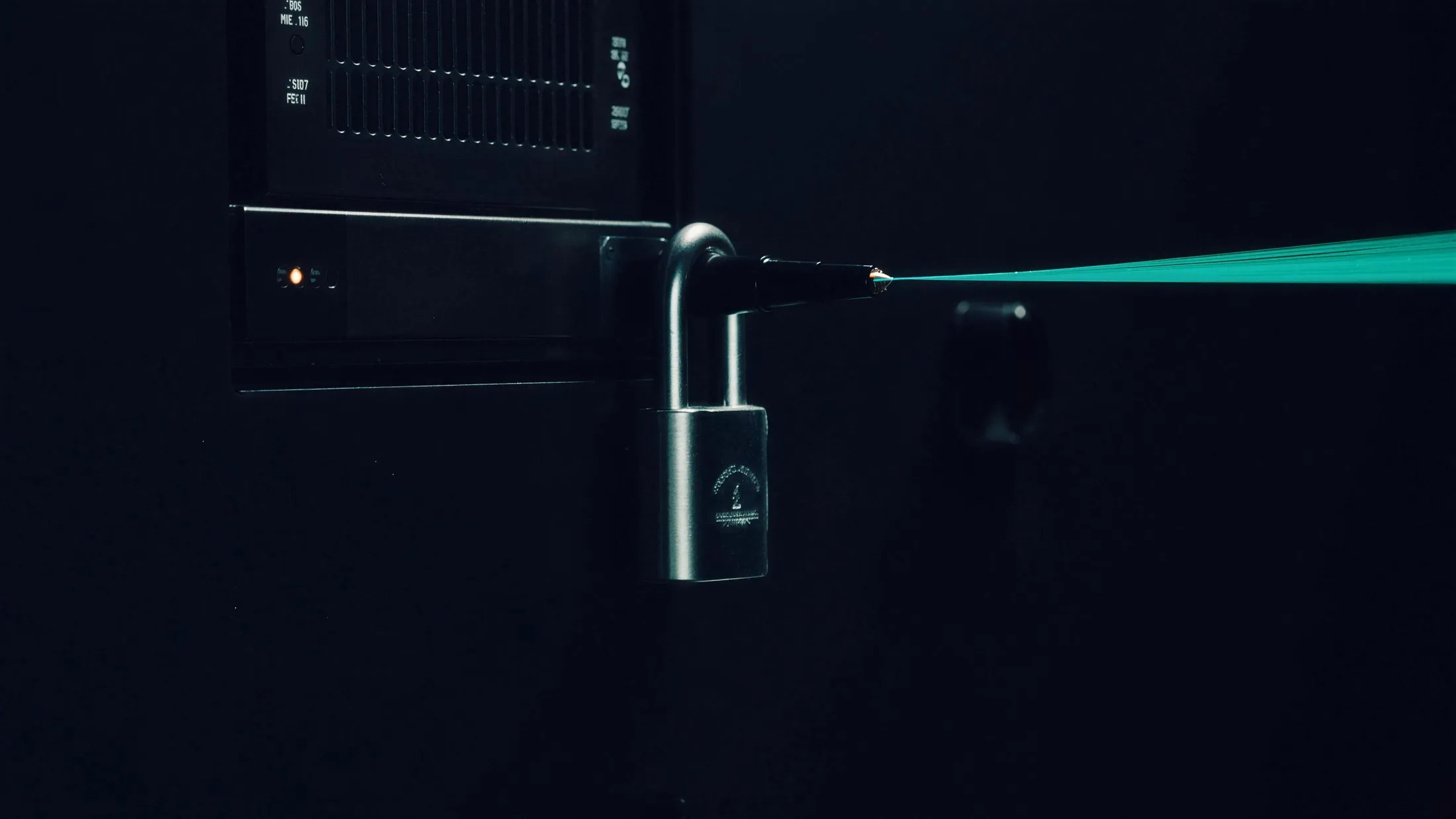 A steel padlock sealing a device's inbound port while a single luminous data thread flows outward toward Front Desk